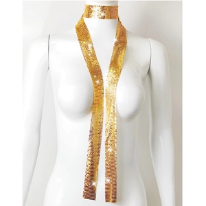 Detail of shimmering gold metal mesh choker and long scarf set on female model