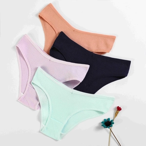 Detail view of four-pack ribbed cotton panties in pastel colors on a white background