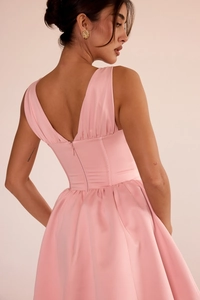 Detailed back view of pink mini dress featuring a zipper closure and high-waist silk texture
