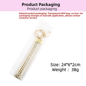 Detail view of white braided keychain with gold square rivets and lobster clasp