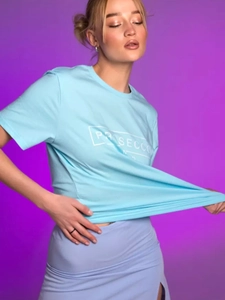 Detail of light blue cotton T-shirt featuring white PROSECCO graphic print on the chest
