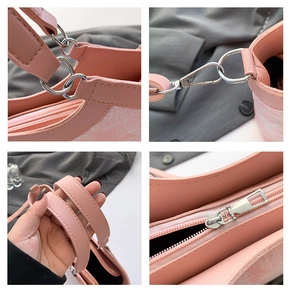 Detail of pink tote bag showing premium leather texture and silver hardware accents