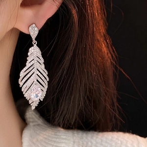 Silver leaf tassel earrings with sparkling cubic zirconia and teardrop stones