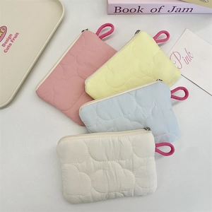 Quilted mini cloud pouch set in pastel colors with zippers and hanging loops