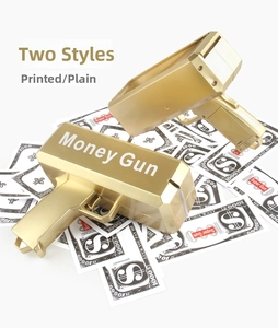 Golden money gun toy in plain and printed styles with scattered prop dollar bills