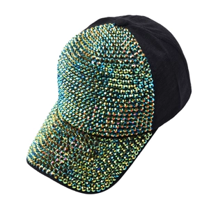 Close-up of sparkling multi-color rhinestones on a black cotton baseball cap
