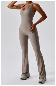 Detail of taupe flare-leg yoga jumpsuit showing U-neckline and high waist slimming fit