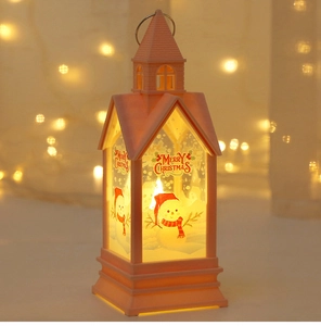 Pink Christmas lantern with snowman print and warm glow for holiday party decoration