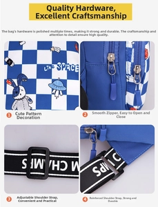 Close-up of blue checkerboard kids sling bag with cartoon rabbit and adjustable strap