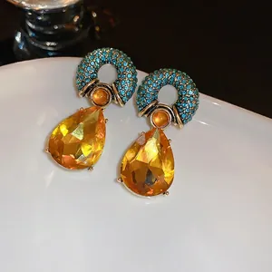 Bohemian vintage drop earrings with blue pave circle and pear-cut yellow crystal