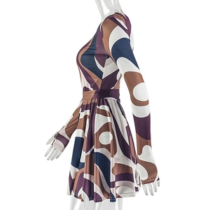 Detail of sleeve thumbhole design on abstract geometric print long sleeve mini dress