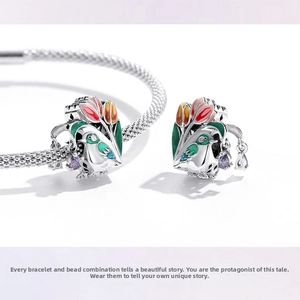 Detailed close-up of 925 sterling silver tulip flower and bird charm with purple zircon