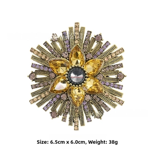 Detail showing vintage sunflower brooch with amber crystal and size info of 6.5cm