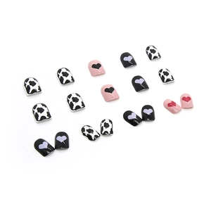 Short cow print and colorful heart press-on nails with a glossy finish for autumn