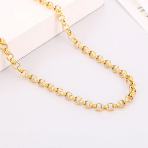 Detailed view of polished gold titanium steel cable chain necklace with smooth ring link