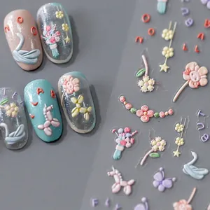3D embossed nail stickers featuring swans, balloons, and floral patterns in pastel colors