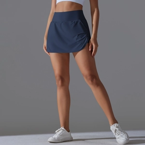 Detailed side view of dark blue high-waisted tennis skort with pleated skirt design