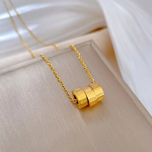 Elegant gold titanium steel necklace with Roman numeral cylinder pendant and O-chain