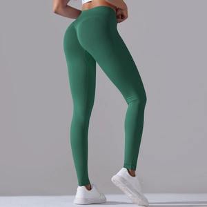 Detail of emerald green seamless yoga leggings with high waist scrunch butt lifting texture