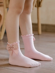 Pink toddler cotton socks with large bow and ruffled edges for little girls