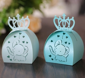 Detailed laser-cut blue baby elephant candy box with crown top and heart patterns