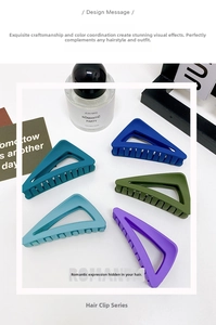 Macro detail of triangle matte hair claws in various colors with a frosted finish