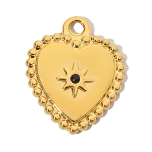 Detailed close-up of heart pendant with gold plating, black gemstone, and starburst inlay