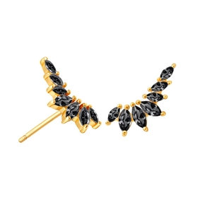 Detail of wing-shaped gold earrings with marquise-cut black zircons on white background