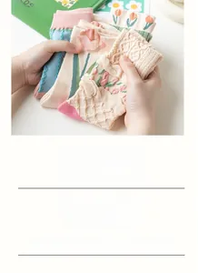 Detailed embroidery of tulips and scalloped edges on soft cotton crew socks
