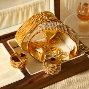 Luxe beaded stainless steel jewelry set with two-tone bracelets and rings in display box