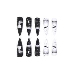 Gothic Halloween stiletto press-on nails with black and white bat and moon patterns