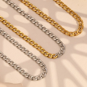 Polished 18K gold and silver stainless steel Cuban link necklaces in a minimalist style