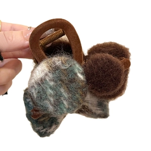 Vintage flocked bow hair claw clip with plush velvet details for thick hair in winter