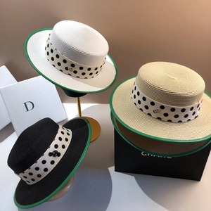 Detail of boater hat straw weaving with green ribbon edge and polka dot ribbon