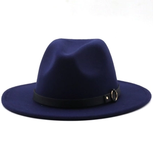 Macro detail of navy wool fedora hat featuring black leather band and gold metal buckle