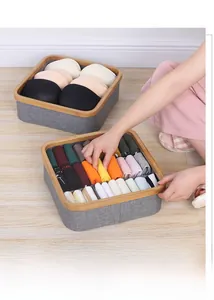 Detail of grey fabric organizers with bamboo frames for bras and socks storage