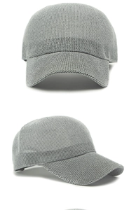Close-up of light grey knit mesh baseball cap showing breathable hollow texture and seams