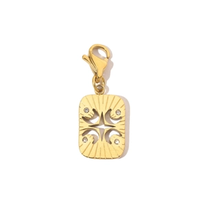 Detailed macro of a gold rectangular pendant with a star cutout and four cubic zirconia