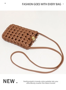 Detail of brown woven leather phone bag featuring a decorative gold metal ball clasp