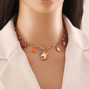 Rainbow heart and unicorn pendant necklace in gold finish on female model neck