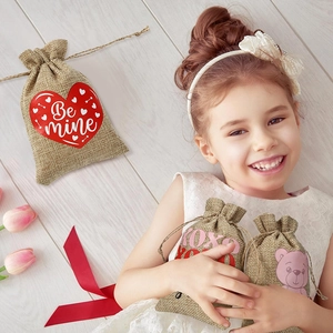 Detail showing burlap Valentine drawstring gift bag with red hearts and cute bear patterns