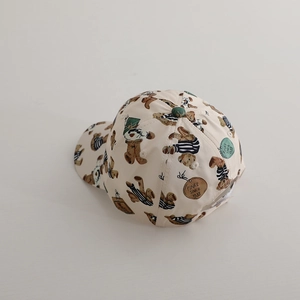 Kids baseball cap with cute cartoon bear print and green top detail in a beige finish
