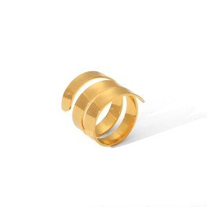Detail view of a polished golden stainless steel spiral layered open ring on white background