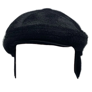 Close-up of black winter newsboy cap for men with warm ear protection earflaps