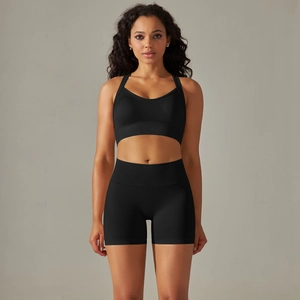 Close-up of seamless black ribbed workout set featuring a sports bra and high-waist shorts