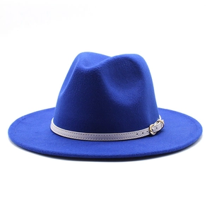 Detail of royal blue wool fedora with white leather belt and gold buckle accent