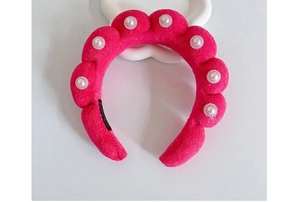 Close-up of red velvet cloud headband with elegant white pearl bead decorations