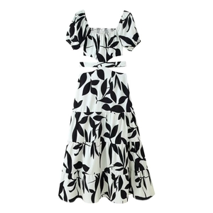White floral maxi dress with black leaf print, square neck and waist cut-outs