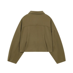 Detail view of olive green bomber jacket back showing high-quality woven fabric texture