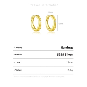 Detail view of gold S925 silver hoop earrings with dimensions 13mm by 11mm and clear crystal